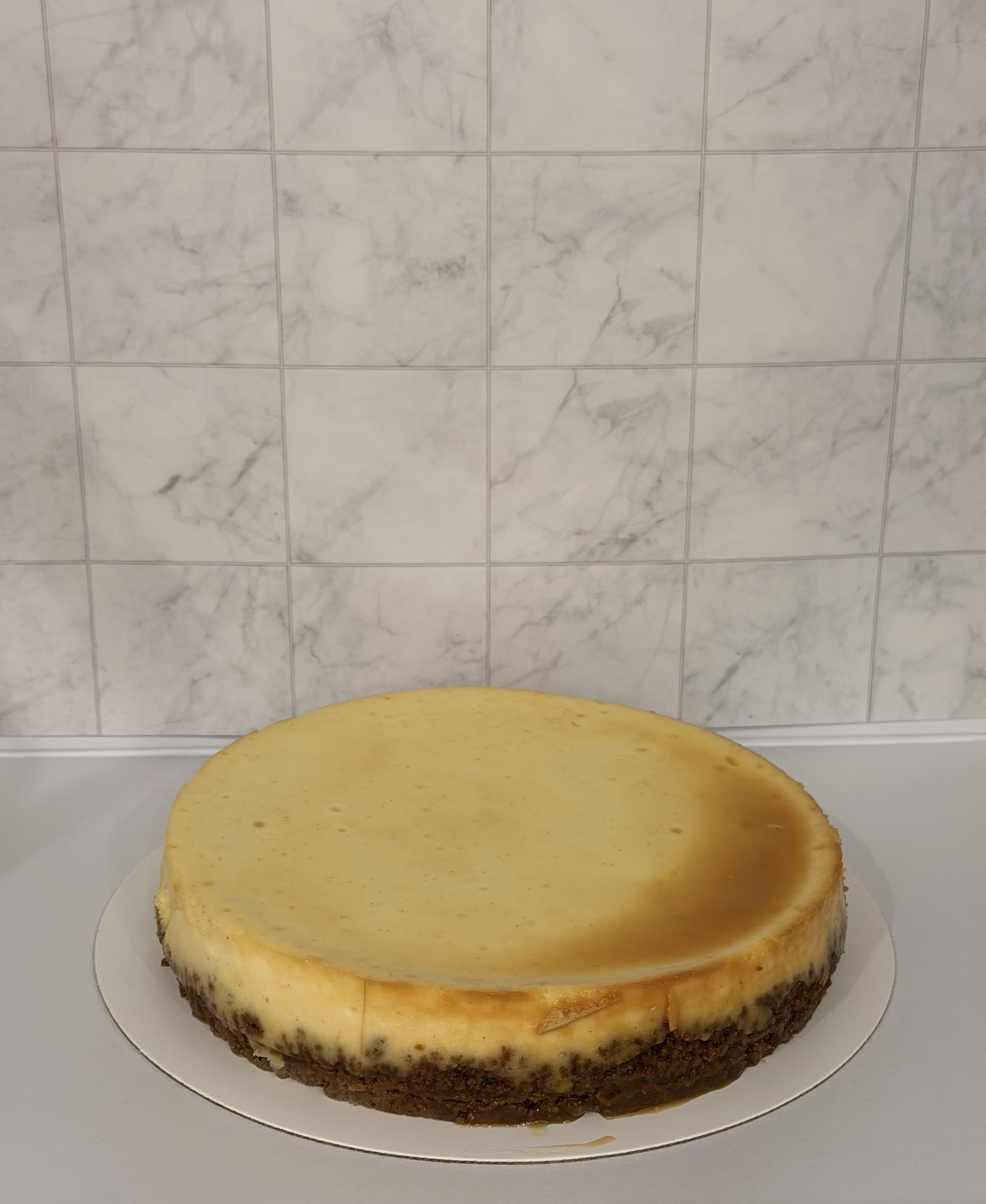 Classic New York cheesecake with a golden top and graham cracker crust