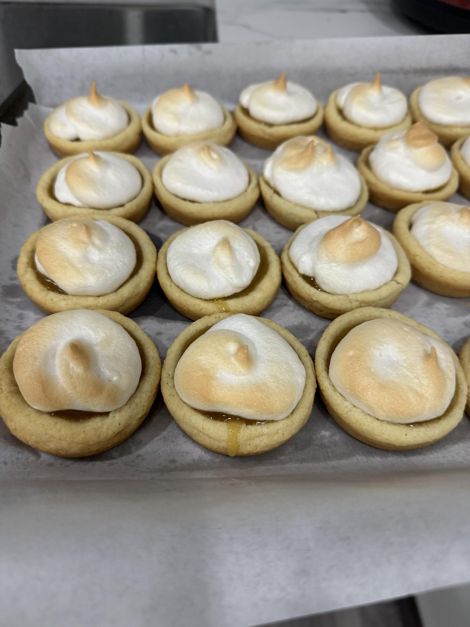 Sugar cookie cups filled with lemon curd and topped with toasted meringue