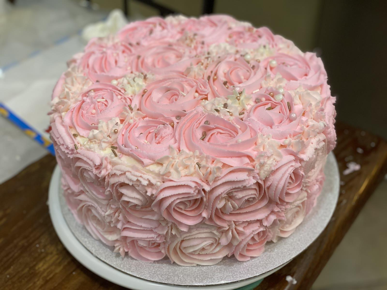 Pink ombre rosette cake with sprinkles and pearl accents